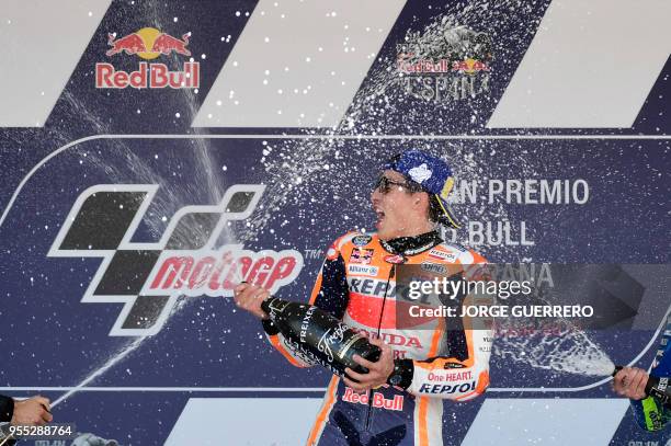 First placed Repsol Honda Team's Spanish rider Marc Marquez celebrates on the podium after the MotoGP race of the Spanish Grand Prix at the Jerez...