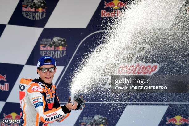 First placed Repsol Honda Team's Spanish rider Marc Marquez celebrates on the podium after the MotoGP race of the Spanish Grand Prix at the Jerez...