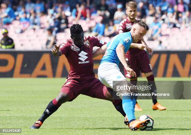 Piotr Zielinski of SSC Napoli vies with Afriyie Acquah of Torino FC during the serie A match between SSC Napoli and Torino FC at Stadio San Paolo on...