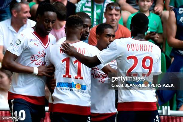 Bordeaux's Senegalese midfielder Younousse Sankhare celebrates with teammates after scoring a goal during the French L1 football match between...