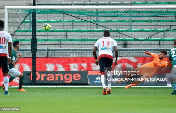 Saint-Etienne's French midfielder Remy Cabella scores a penalty kick during the French L1 football match between Saint-Etienne and Bordeaux on May 6...