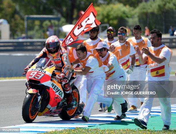 First placed Repsol Honda Team's Spanish rider Marc Marquez celebrates winning the MotoGP race of the Spanish Grand Prix at the Jerez Angel Nieto...