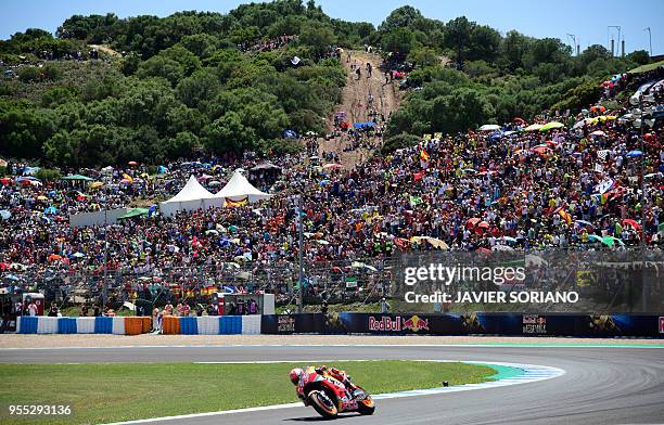 First placed Repsol Honda Team's Spanish rider Marc Marquez competes during the MotoGP race of the Spanish Grand Prix at the Jerez Angel Nieto...
