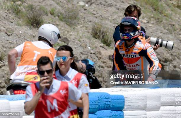 Repsol Honda Team's Spanish rider Dani Pedrosa leaves the track after falling down during the MotoGP race of the Spanish Grand Prix at the Jerez...