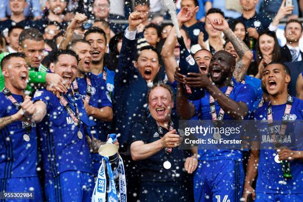 Neil Warnock, Manager of Cardiff City and his team celebrate with his team as they gain promotion to the premier league during the Sky Bet...