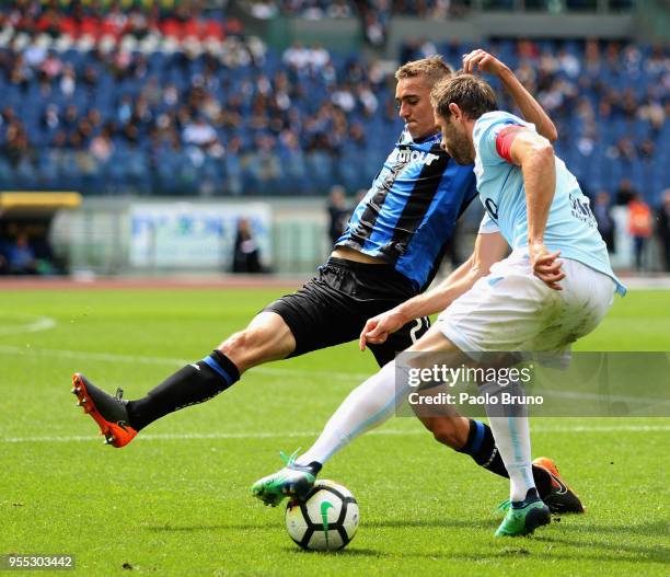 Senad Lulic of SS Lazio competes for the ball with Timothy Castagne of Atalanta BC during the Serie A match between SS Lazio and Atalanta BC at...