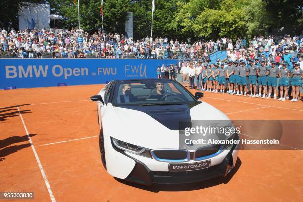 Alexander Zverev of Germany drives with Oliver Zipse, member of the BMW Board the winners car, a BMW i8 Roadster after winning his finalmatch against...