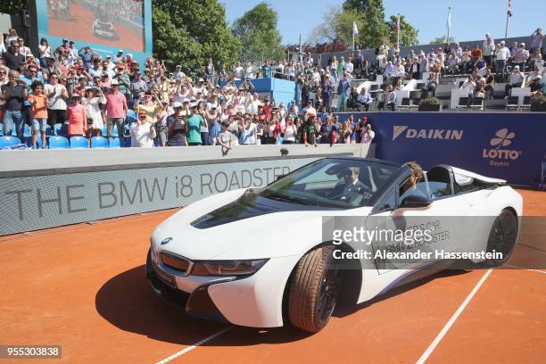 Alexander Zverev of Germany drives with Oliver Zipse, member of the BMW Board the winners car, a BMW i8 Roadster after winning his finalmatch against...