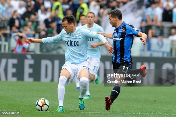 Alessandro Murgia of SS Lazio competes for the ball with Remo Freulerof Atalanta BC during the serie A match between SS Lazio and Atalanta BC at...