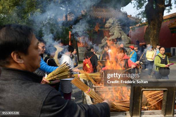 Yonghe Temple in Beijing. Chinese burn incense for good fortune at the Yonghe Temple, aka the 'Yonghe Lamasery', or, popularly, the "Lama Temple", a...