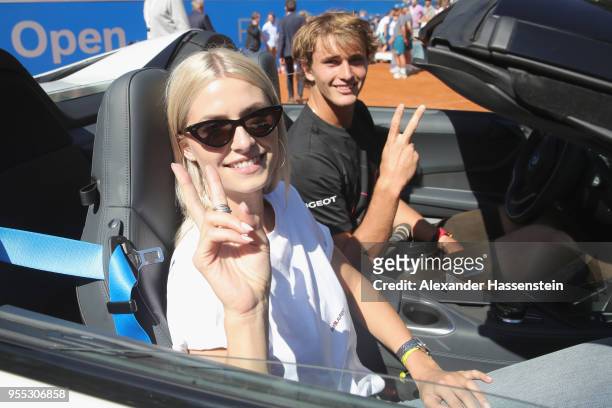 Alexander Zverev of Germany drives with Lena Gerke the winners car, a BMW i8 Roadster after winning his finalmatch against Philipp Kohlschreiber of...