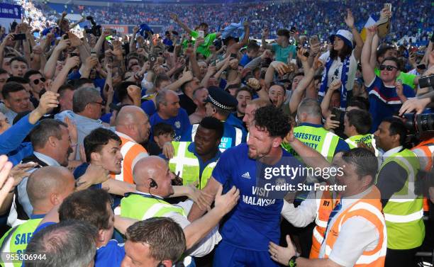 Cardiff captain Sean Morrison leaves the field congratulated by fans after the Sky Bet Championship match between Cardiff City and Reading at Cardiff...