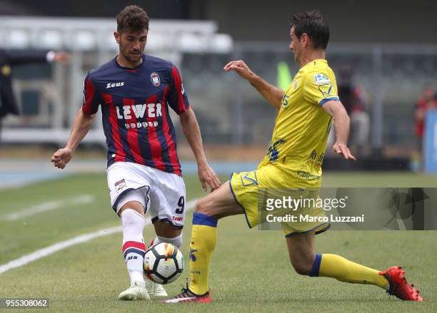 Andrea Nalini of FC Crotone competes for the ball with Massimo Gobbi of AC Chievo Verona during the serie A match between AC Chievo Verona and FC...