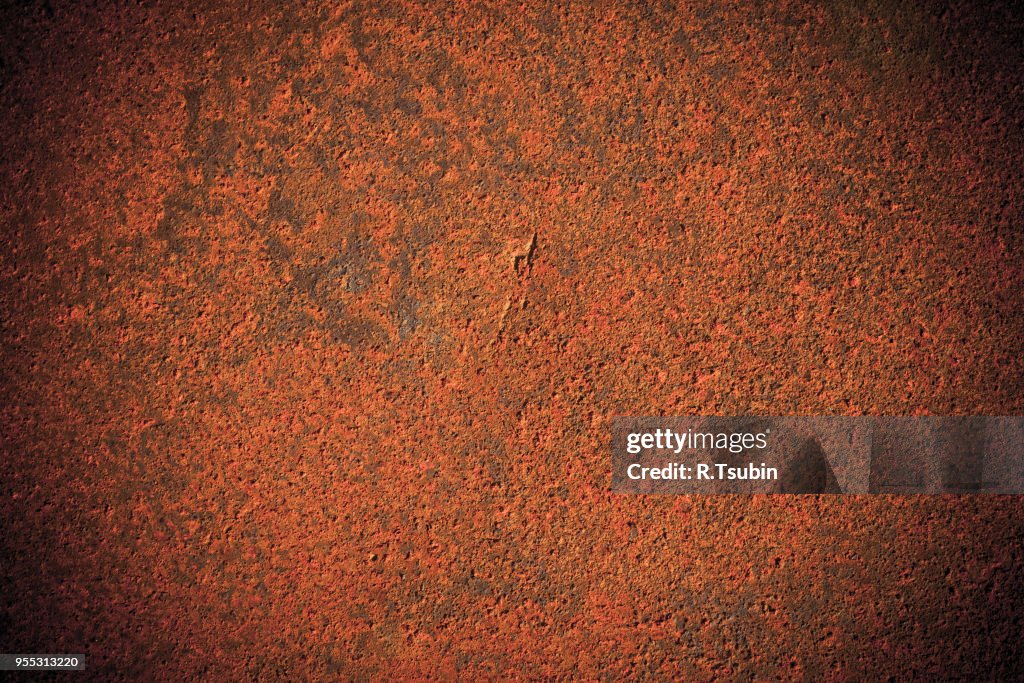 Dark edged old rusty iron metal plate background