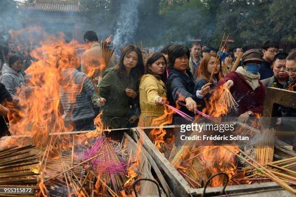 Yonghe Temple in Beijing. Chinese burn incense for good fortune at the Yonghe Temple, aka the 'Yonghe Lamasery', or, popularly, the "Lama Temple", a...
