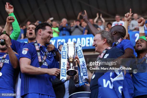 Cardiff City manager Neil Warnock and Captain Sean Morrison hold the trophy during the Sky Bet Championship match between Cardiff City and Reading at...