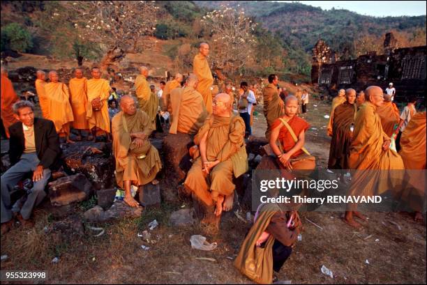 Vat Phu, the bonzes await the beginning of the closing ceremony for the annual festival .