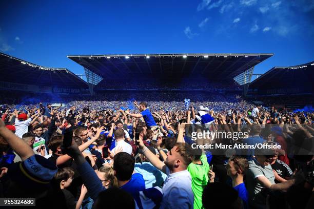 Cardiff fans invade the pitch as they celebrate promotion during the Sky Bet Championship match between Cardiff City and Reading at Cardiff City...