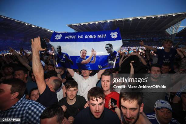 Cardiff fans celebrate with a banner featuring manager Neil Warnock during the Sky Bet Championship match between Cardiff City and Reading at Cardiff...