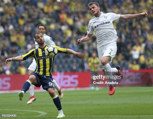 Roberto Soldado of Fenerbahce in action against Ertugrul Ersoy of Bursaspor during Turkish Super Lig soccer match between Fenerbahce and Bursaspor at...