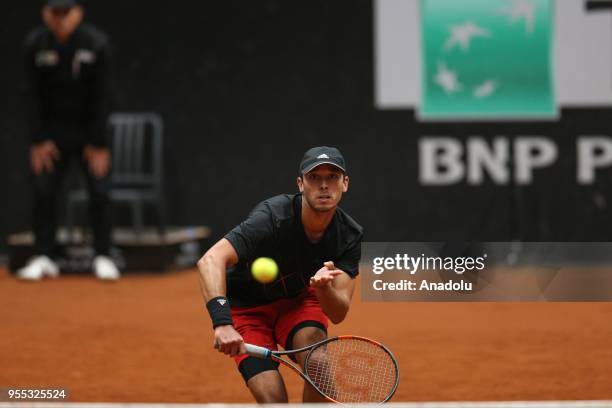 Ben McLachlan of Japan and Nicholas Monroe of USA in action against Dominic Inglot of Great Britain andi Robert Lindstedt of Sweden during TEB BNP...