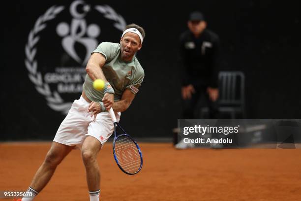 Dominic Inglot of Great Britain andi Robert Lindstedt of Sweden in action against Nicholas Monroe of USA and Ben McLachlan of Japan during TEB BNP...