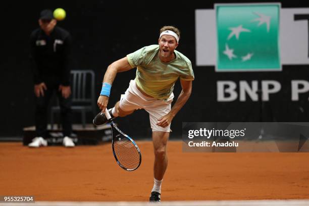 Dominic Inglot of Great Britain andi Robert Lindstedt of Sweden in action against Nicholas Monroe of USA and Ben McLachlan of Japan during TEB BNP...