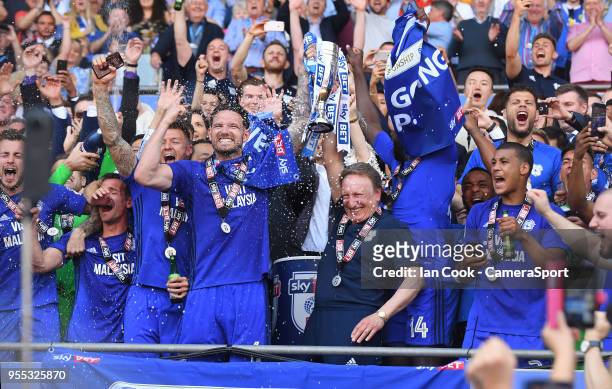 Cardiff City manager Neil Warnock and Cardiff City's Captain Sean Morrison celebrate winning promotion to the Premier League during the Sky Bet...