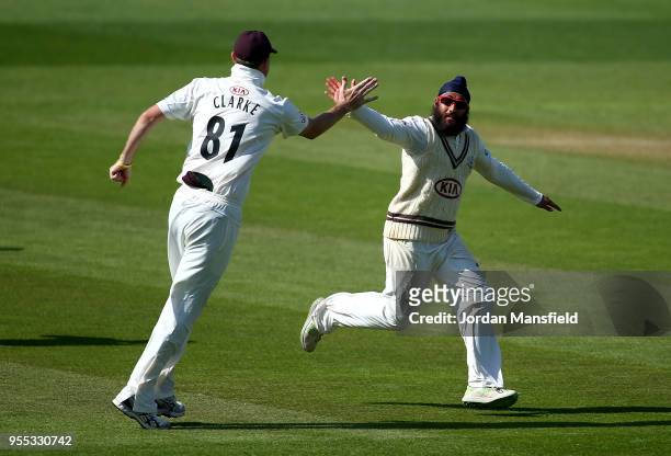Amar Virdi of Surrey celebrates dismissing Ben Cox of Worcestershire during day three of the Specsavers County Championship Division One match...