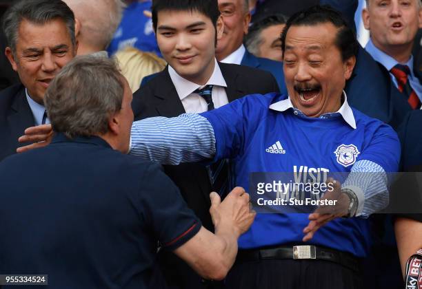 Cardiff owner Vincent Tan and manager Neil Warnock celebrate promotion to the premier league after the Sky Bet Championship match between Cardiff...