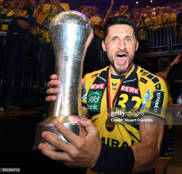 Alexander Petersson of Rhein-Neckar celebrates winning the final of the DKB Handball Bundesliga Final Four between Hannover and Rhein-Neckar Loewen...