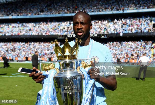 Yaya Toure of Manchester City celebrates with The Premier League Trophy after the Premier League match between Manchester City and Huddersfield Town...