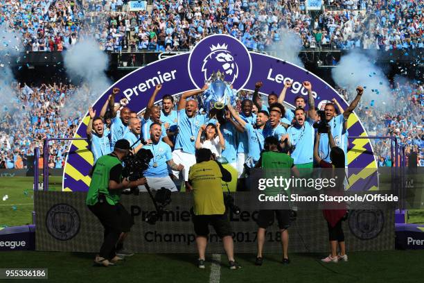 Man City lift the trophy at the end of the Premier League match between Manchester City and Huddersfield Town at the Etihad Stadium on May 6, 2018 in...