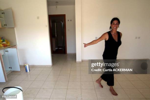 Northern Gaza settler woman from Nissanit shows off her new home in the new settlement of Nitzan, just north of Gaza, ahead of the Aug. 14 deadline....