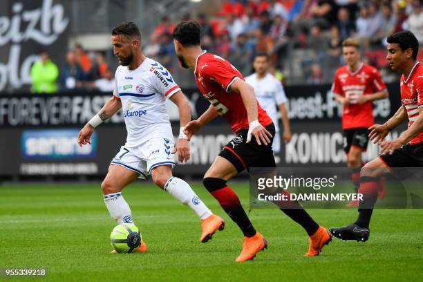 Strasbourg's French forward Ihsan Sacko vies with Rennes'Algeria defender Ramy Bensebaini during the French L1 football match Rennes against...