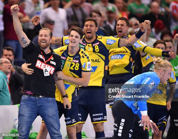 Oliver Roggisch, manager of Rhein-Neckar celebrates with the players during the final of the DKB Handball Bundesliga Final Four between Hannover and...