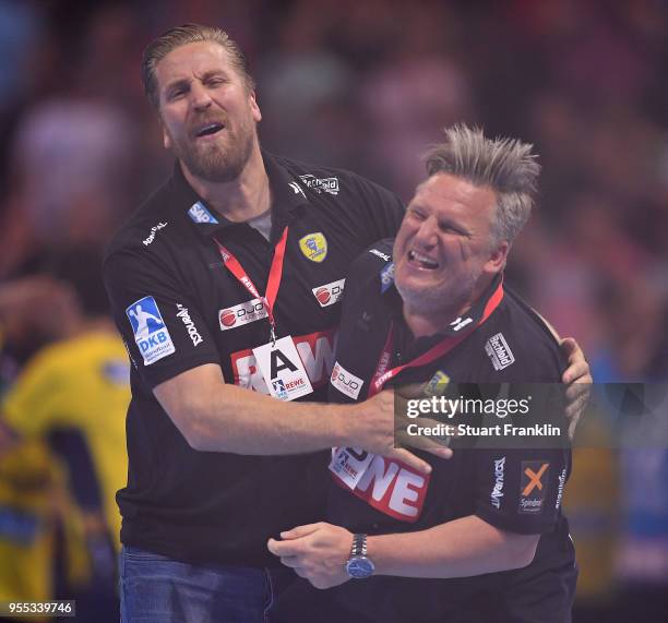 Oliver Roggisch, manager of Rhein-Neckar celebrates with head coach Nikolaj Jacobsen during the final of the DKB Handball Bundesliga Final Four...