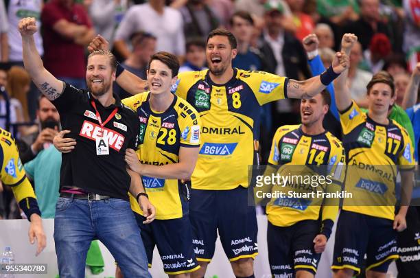 Oliver Roggisch, manager of Rhein-Neckar celebrates with the players during the final of the DKB Handball Bundesliga Final Four between Hannover and...