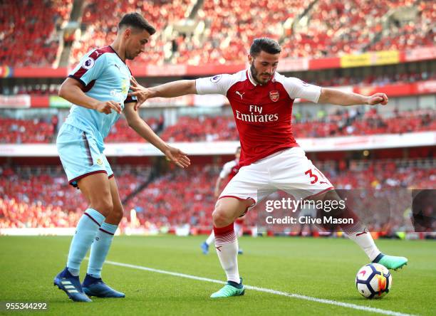 Sead Kolasinac of Arsenal is challenged by Matthew Lowton of Burnley during the Premier League match between Arsenal and Burnley at Emirates Stadium...