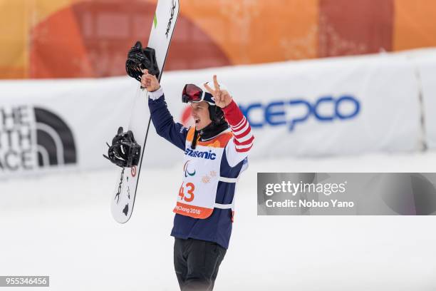 Silver Medalist Evan Strong of the United States celebrates during the victory ceremony following the Men's Banked Slalom SB-LL2 Run 3 during day...