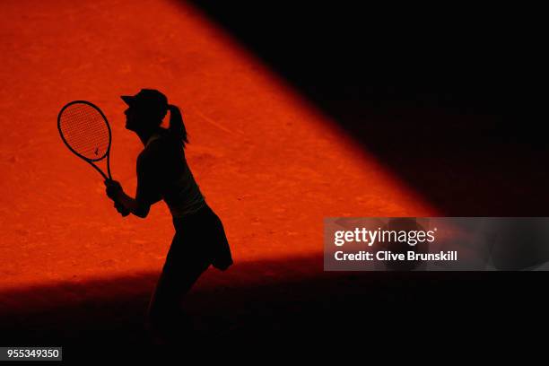 Maria Sharapova of Russia in action against Mihaela Buzarnescu of Romania in their first round match during day two of the Mutua Madrid Open tennis...