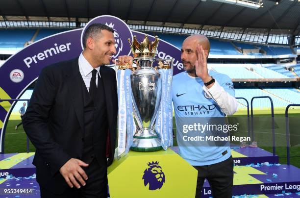 Khaldoon al-Mubarak, Manchester City chairman and Josep Guardiola, Manager of Manchester City pose with the Premier League trophy as Manchester City...