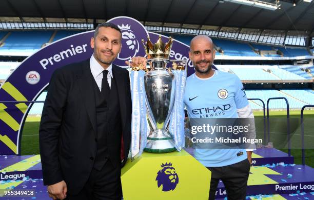 Khaldoon al-Mubarak, Manchester City chairman and Josep Guardiola, Manager of Manchester City pose with the Premier League trophy as Manchester City...