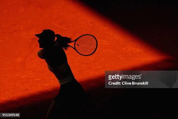 Maria Sharapova of Russia in action against Mihaela Buzarnescu of Romania in their first round match during day two of the Mutua Madrid Open tennis...