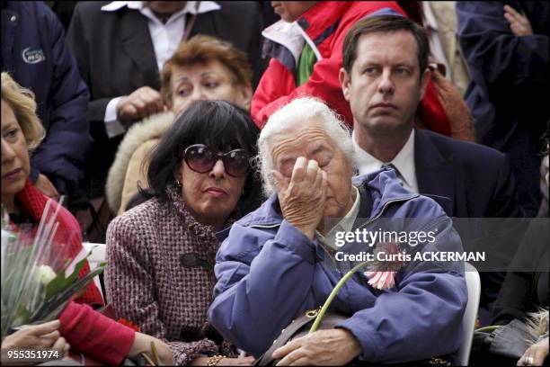 The late Prime Minister Yitzhak Rabin's sister, Rachel Ya'akov, wipes a tear at a grave site memorial service in Jerusalem's Mt. Herzl cemetery on...