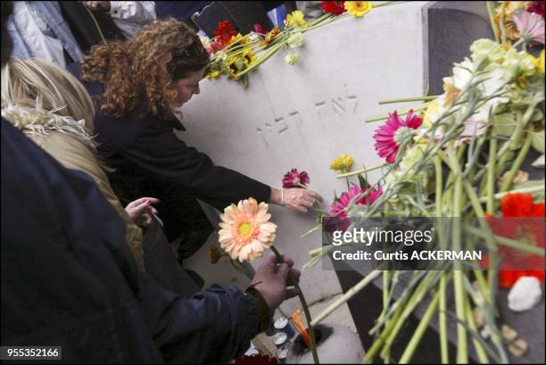 The late Prime Minister Yitzhak Rabin's daughter, Daliah lights a memorial candle, at a grave site memorial service in Jerusalem's Mt. Herzl cemetery...