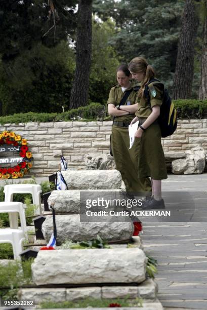 Two women soldiers say a prayer and remember a fallen comrade at Mt. Herzl Military Cemetery in Jerusalem on Wednesday, May 11, 2005. Israel is...