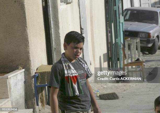 An Israeli Arab boy in the street in the East Jerusalem village of Silwan on Saturday June 4, 2005. The Knesset will Wednesday debate an urgent...