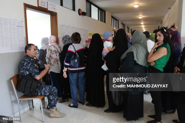 Lebanese women wait to vote at a polling station in the city of Nabatieh in southern Lebanon on May 6 as the country voted in its first parliamentary...