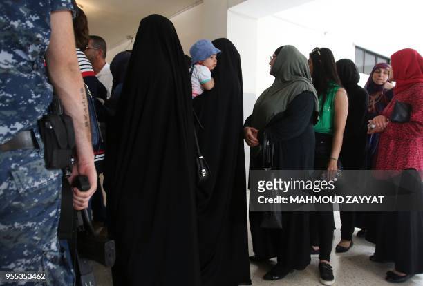 Lebanese women wait to vote at a polling station in the city of Nabatieh, in southern Lebanon, on May 6 as the country voted in its first...